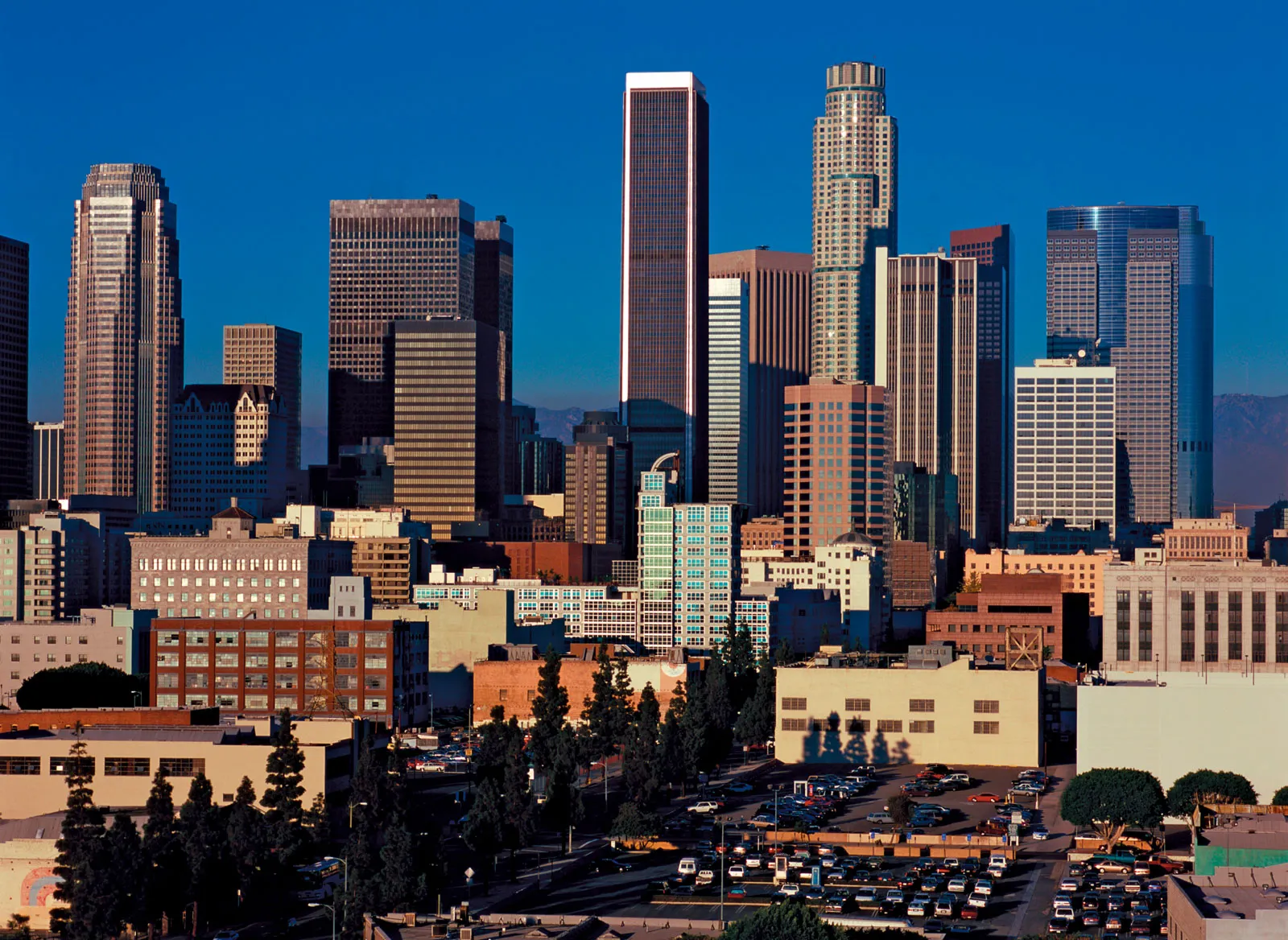 Los Angeles downtown city view with trees and cars, part of the 10 Most Expensive Cities in the world.
