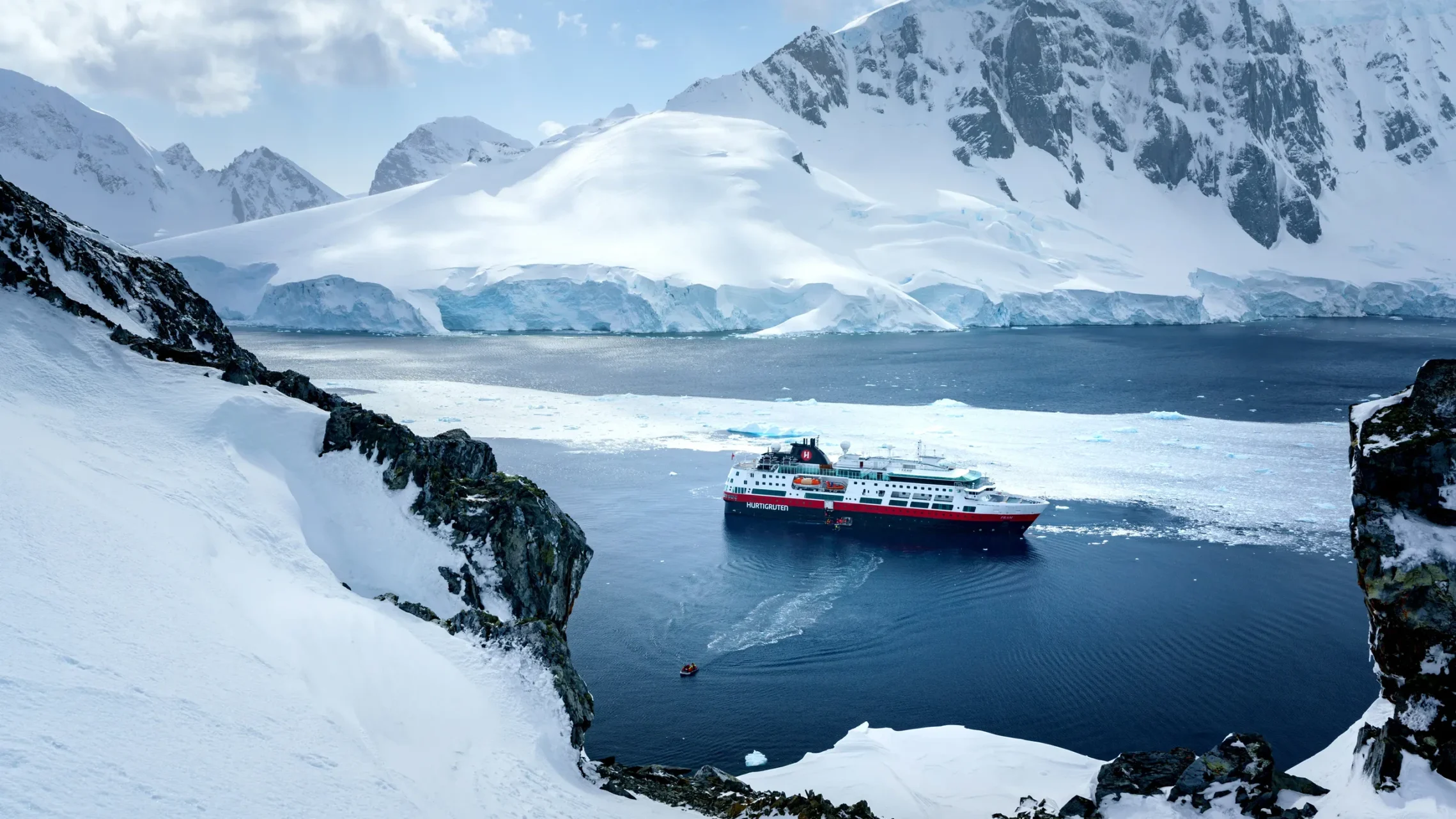 Cruising past glaciers in Antarctica – 10 Best Travel Experiences in the World for epic polar expeditions.