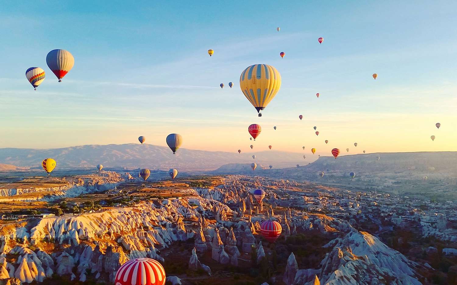 Hot Air Balloon Ride over Cappadocia, Turkey – 10 Best Travel Experiences in the World for aerial adventure and surreal views.