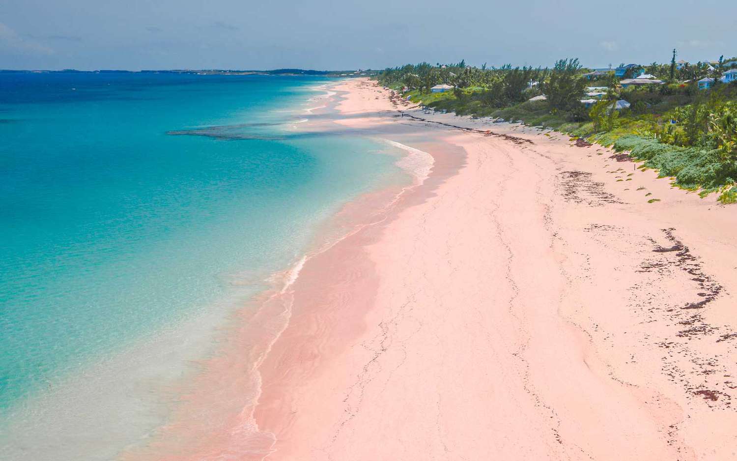 10 Best Beaches in the World – Pink Sands Beach with rosy-colored sand and gentle Atlantic waves.