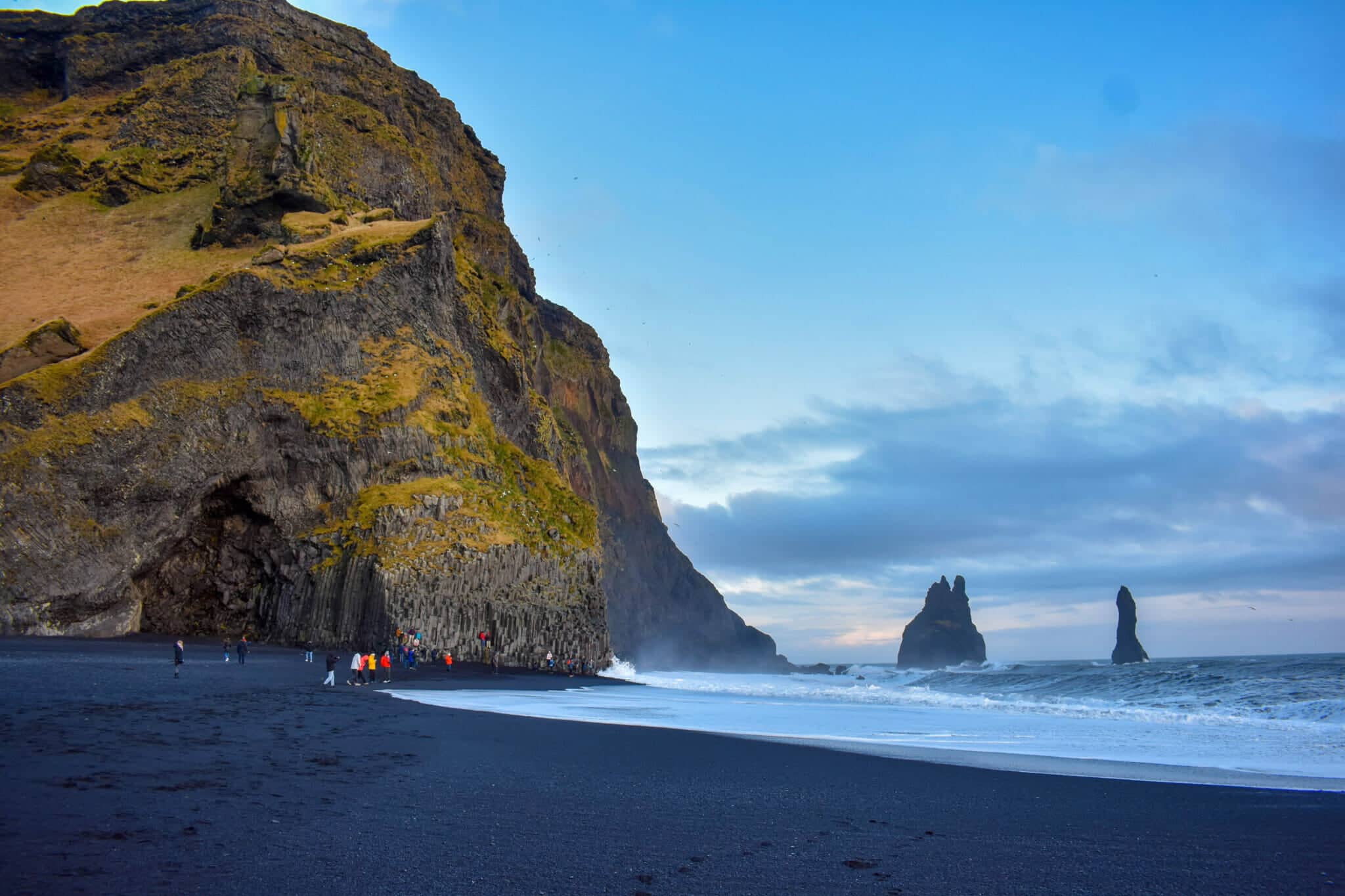 10 Best Beaches in the World – Reynisfjara with volcanic black sand, basalt columns, and moody Atlantic scenery.