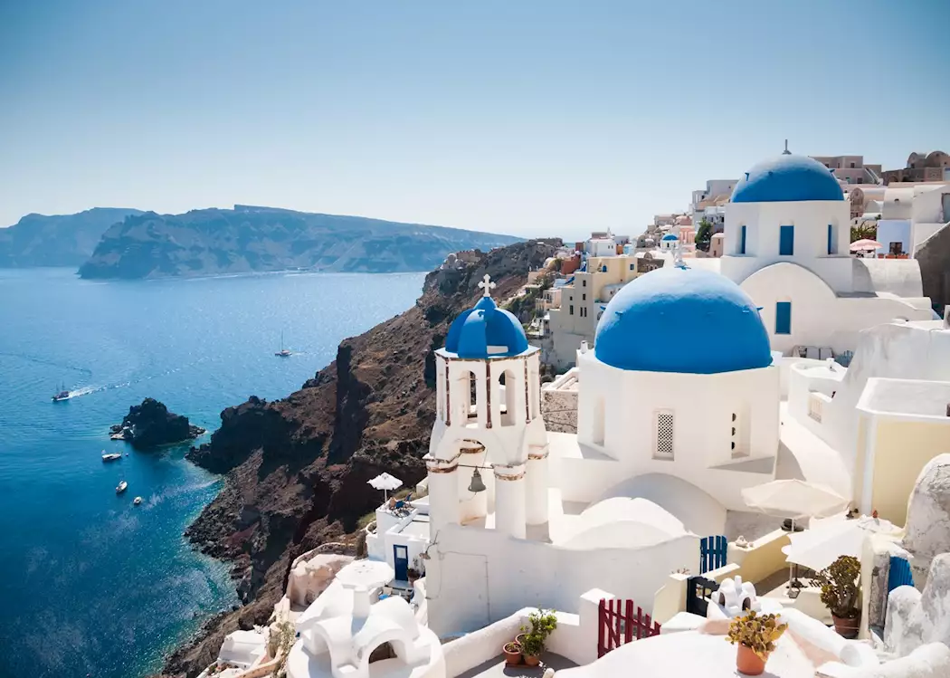 10 Top Tourist Attractions in the World – Santorini's whitewashed buildings and blue domes.