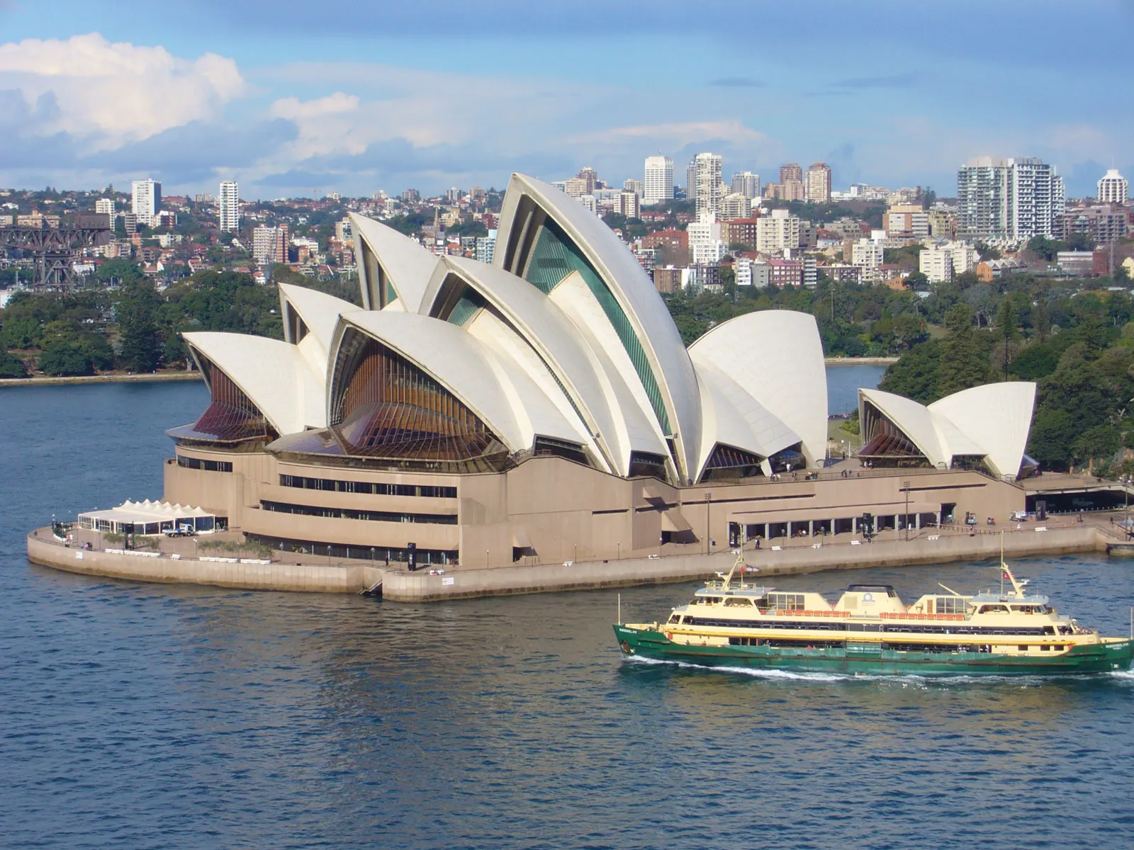10 Top Tourist Attractions in the World – Sydney Opera House and its iconic sail-like architecture.