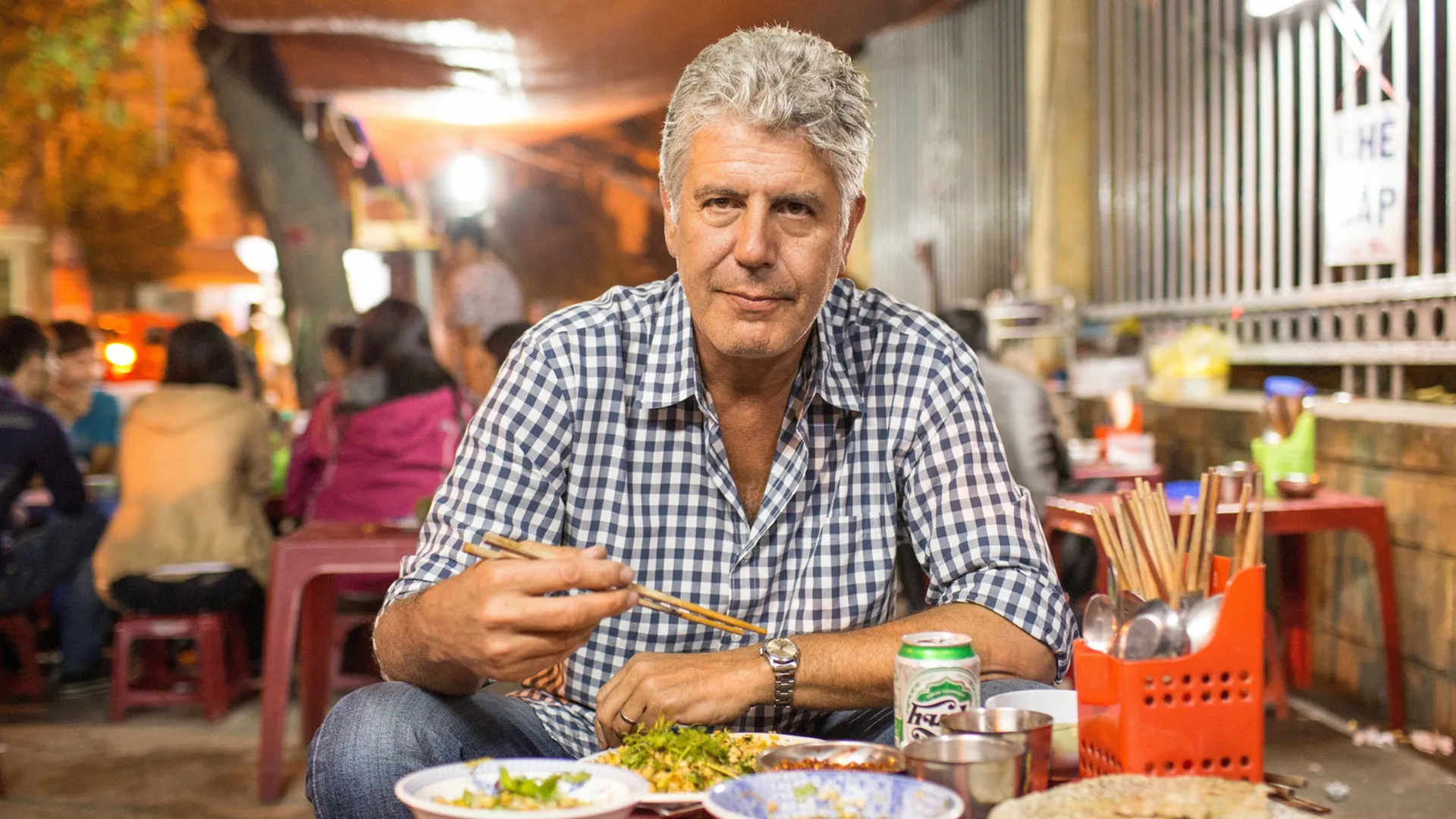 Anthony Bourdain exploring street food – cultural icon in the 10 Most Famous Chefs in the World known for travel and food shows.