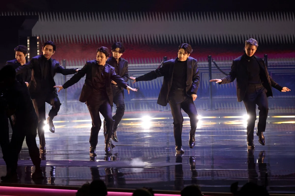 BTS performing in concert, representing the 10 Most Famous Musicians in the World in K-pop.