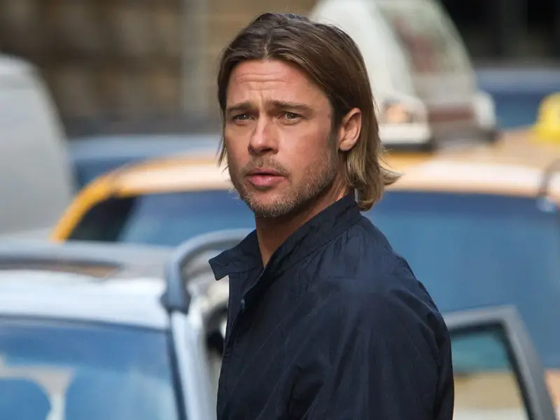 Brad Pitt posing, recognized as one of the 10 Most Famous Actors in the World for diverse film roles.