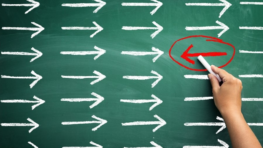 Contrarian Investing image in 10 Most Famous Investment Strategies showcasing buying against market sentiment for value.