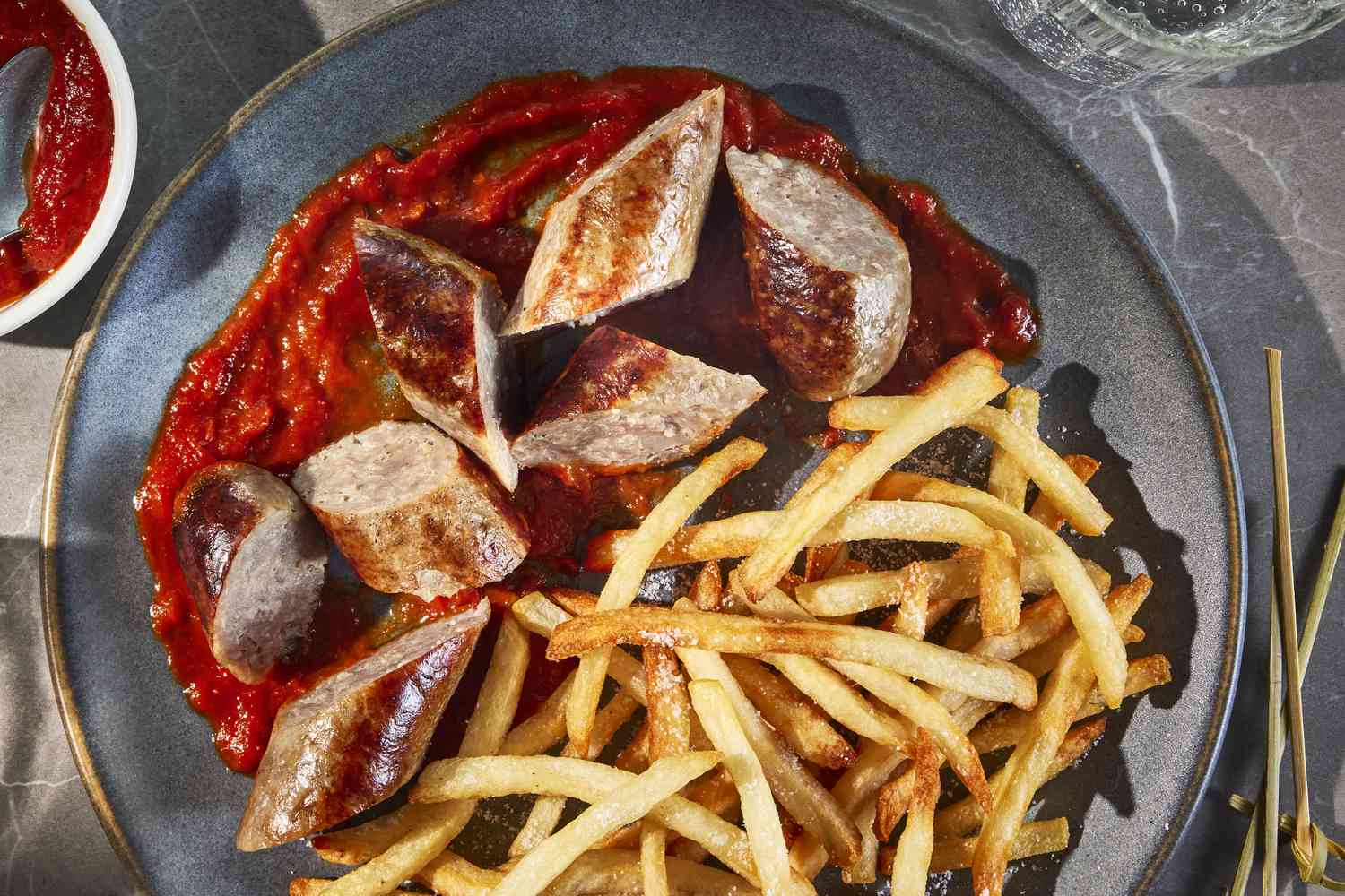 German currywurst with curry ketchup and fries — a highlight of the 10 Most Famous Street Foods in the World.