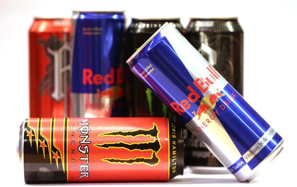 Cans of popular energy drinks showcasing caffeine power in the 10 Most Popular Beverages in the World.