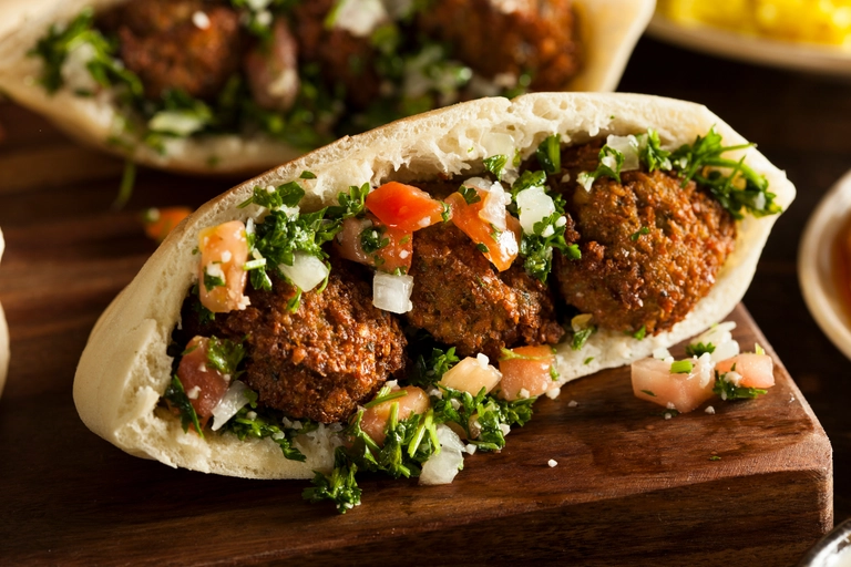Golden fried falafel balls in pita bread — listed in the 10 Most Famous Street Foods in the World collection.