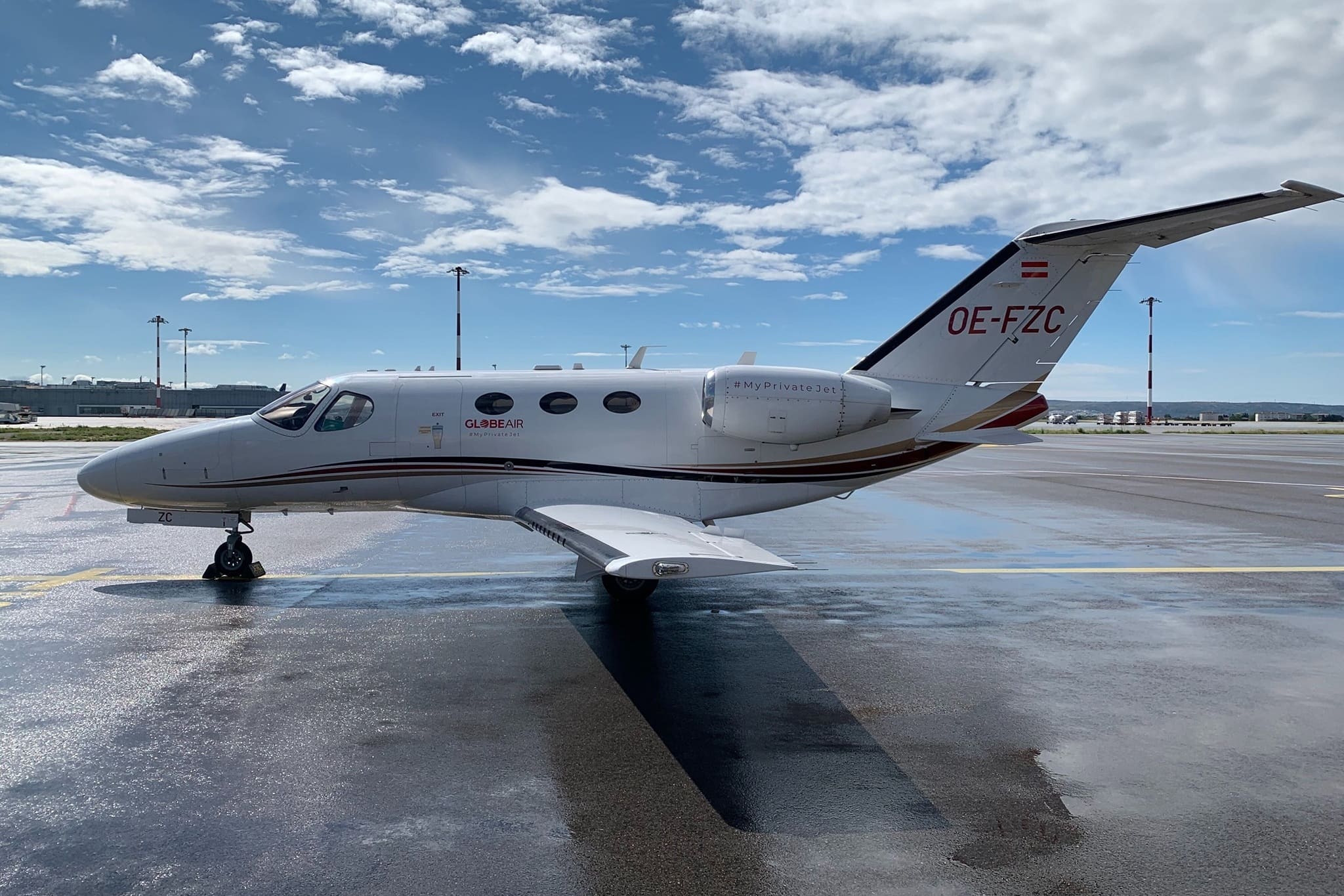 GlobeAir Citation Mustang jet parked at a European airport, a regional leader in the 10 Most Popular Private Jet Charters.