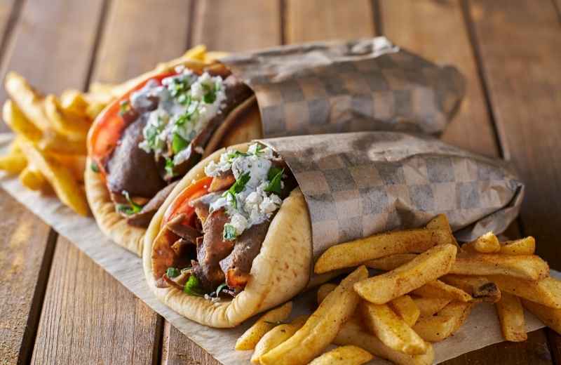 Greek gyros wrapped in pita with tzatziki sauce — highlighted in the 10 Most Famous Street Foods in the World.