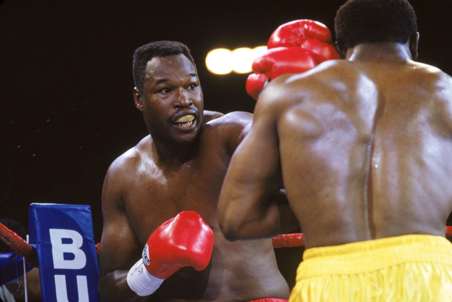 Larry Holmes throwing a jab, featured in the 10 Most Famous Boxers in the World, respected for his technical skills.