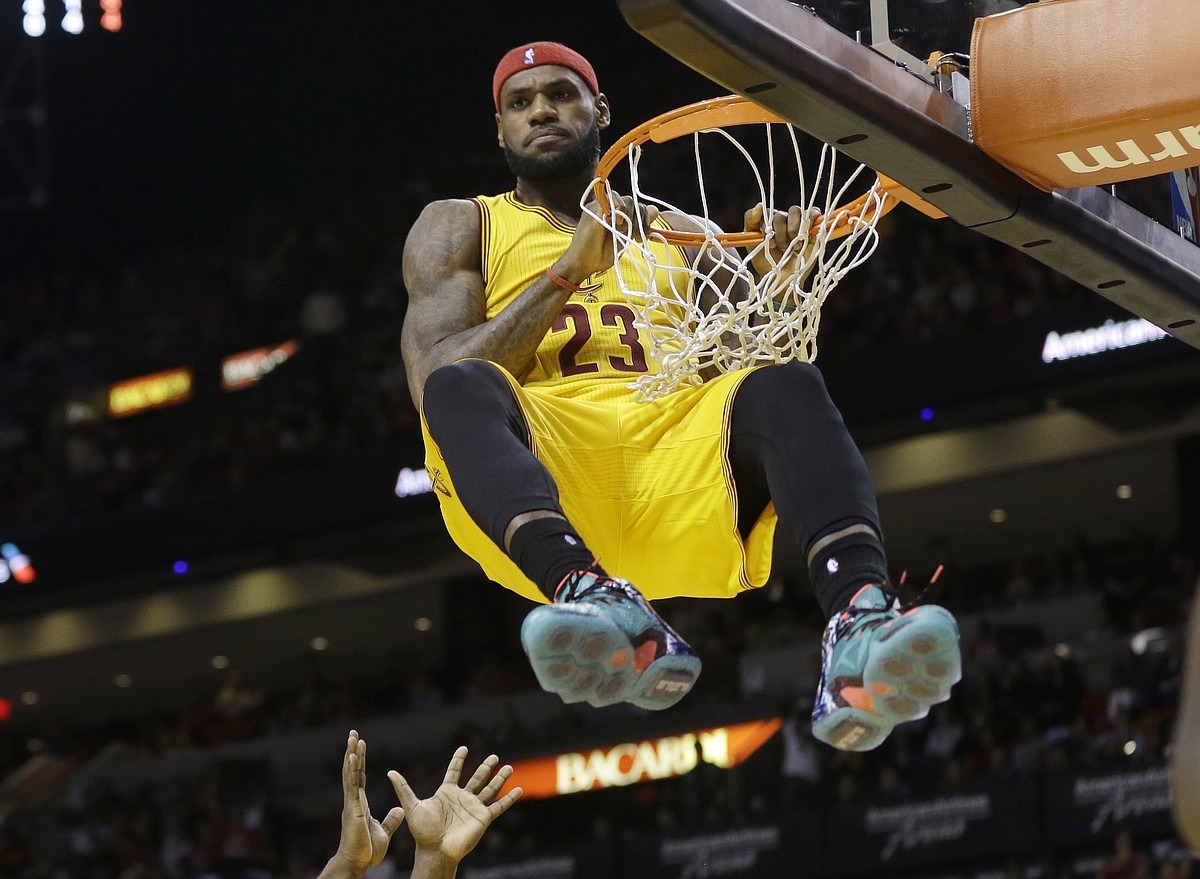 LeBron James slam dunk – Top 10 Most Famous Athletes in the World, basketball superstar and NBA champion.
