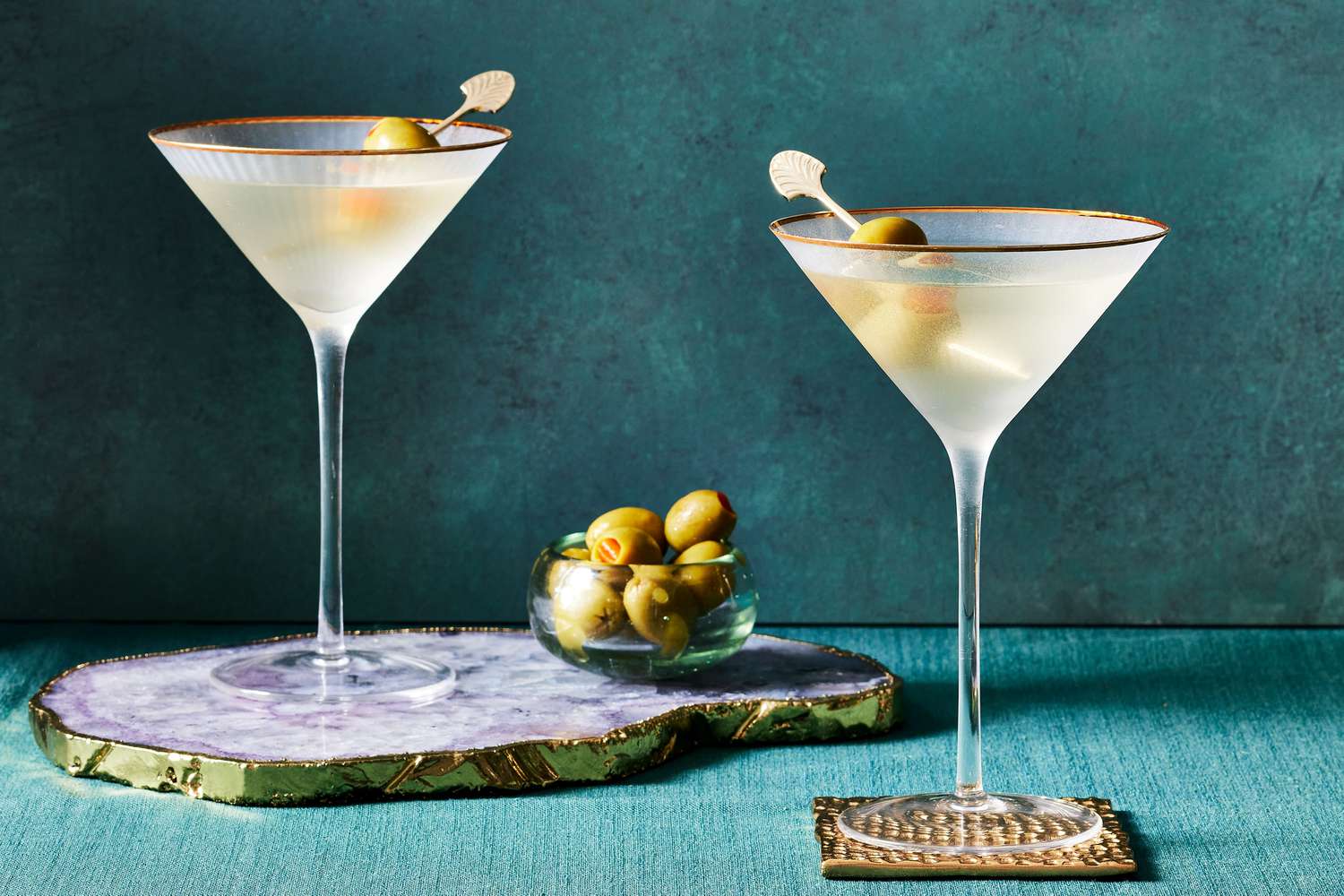 Martini with olive garnish – a sleek and iconic drink from the 10 Most Popular Cocktails in the World enjoyed at elegant events.