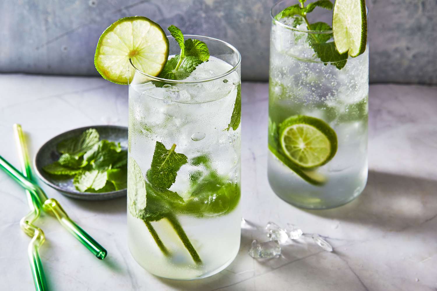 Mojito with fresh mint and lime in a tall glass – part of the 10 Most Popular Cocktails in the World known for its refreshing flavor.