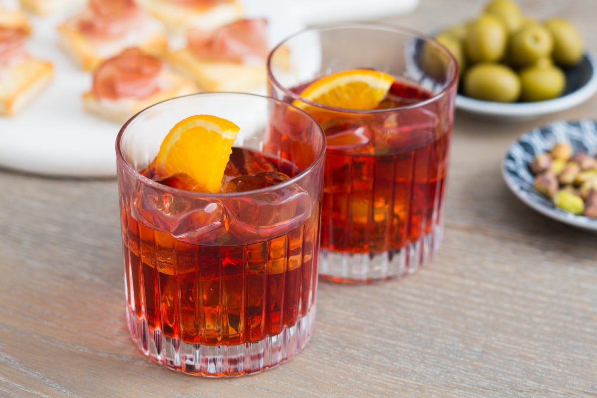 Negroni cocktail with orange garnish – a bitter Italian favorite on the list of the 10 Most Popular Cocktails in the World.