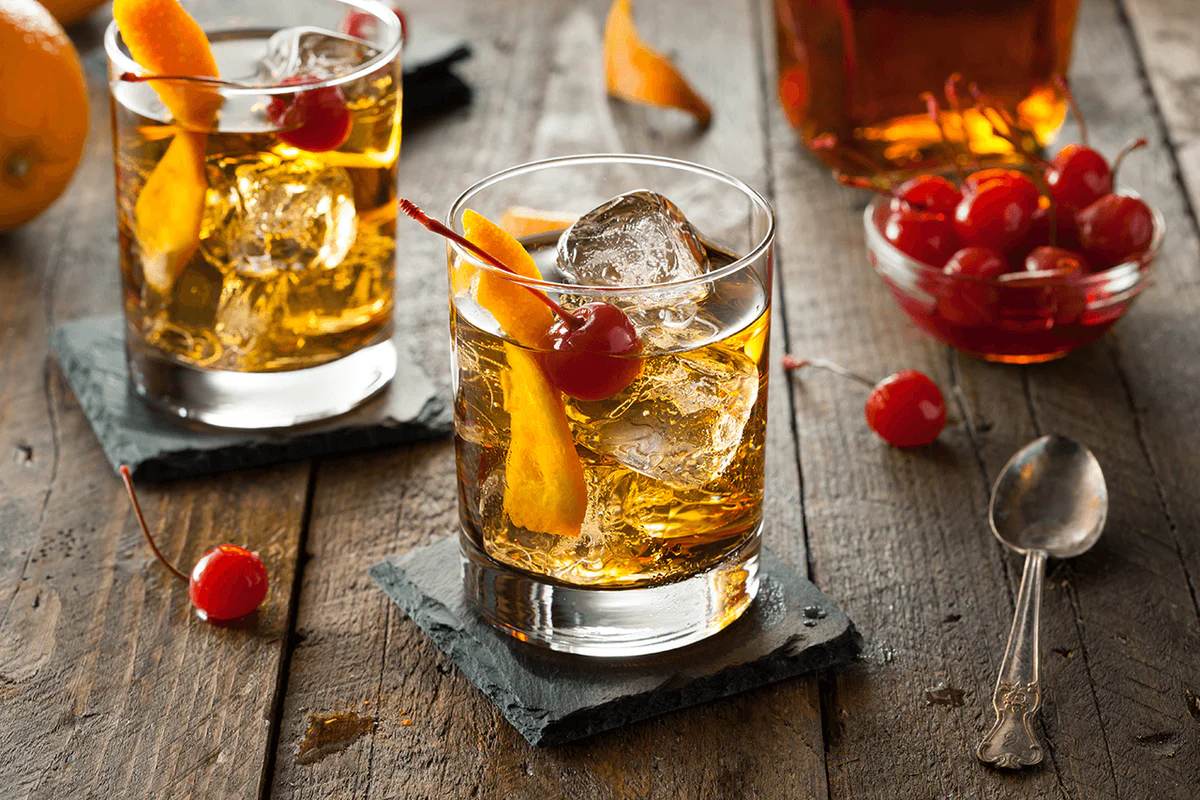 Old Fashioned with orange peel and ice – featured in the 10 Most Popular Cocktails in the World for its strong, whiskey-forward profile.
