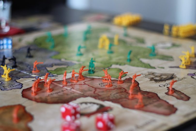Risk board game mid-battle, showcasing global conquest strategy from the 10 Most Popular Board Games in the World series.