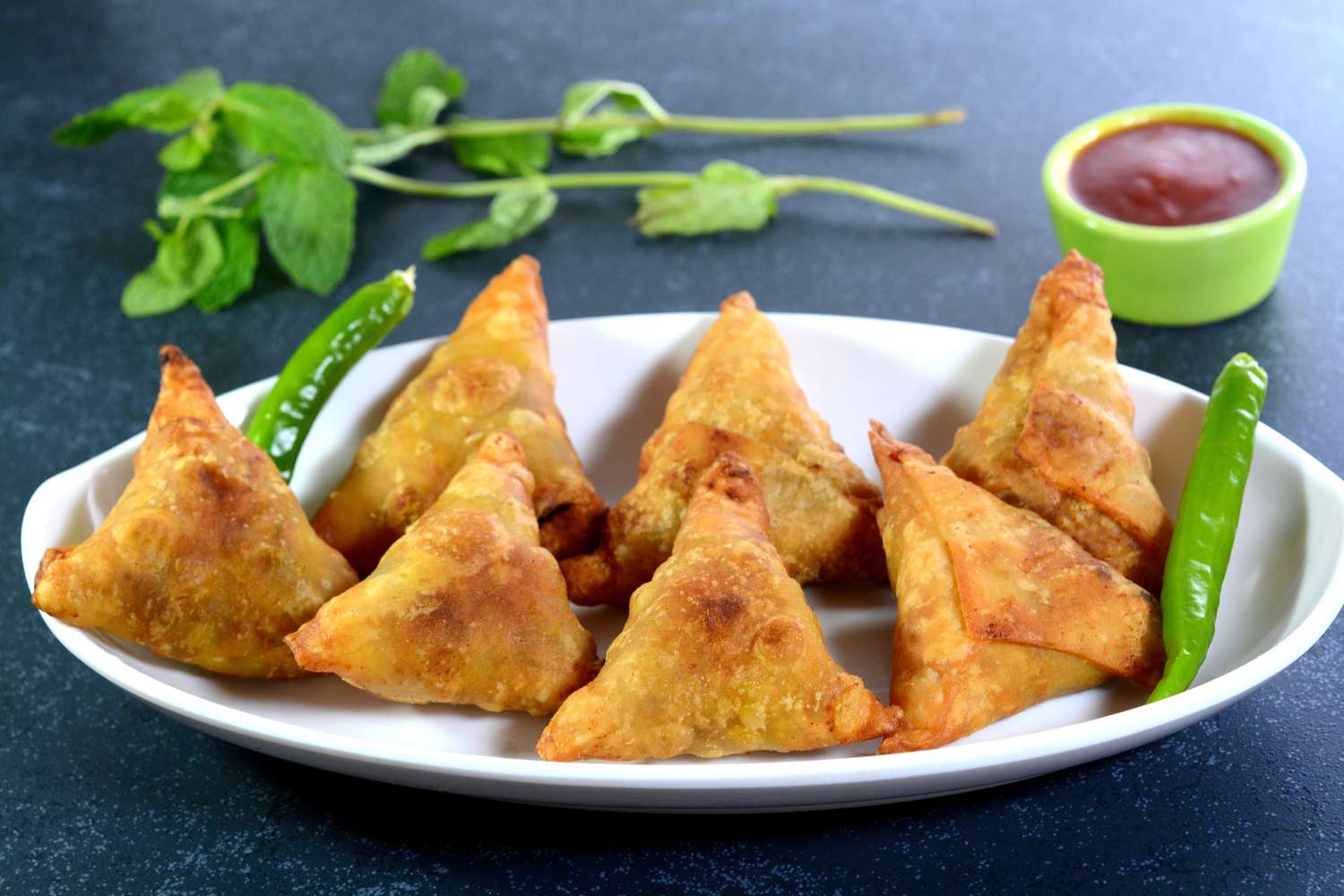 Hot and crispy samosas served from Indian — part of the 10 Most Famous Street Foods in the World.
