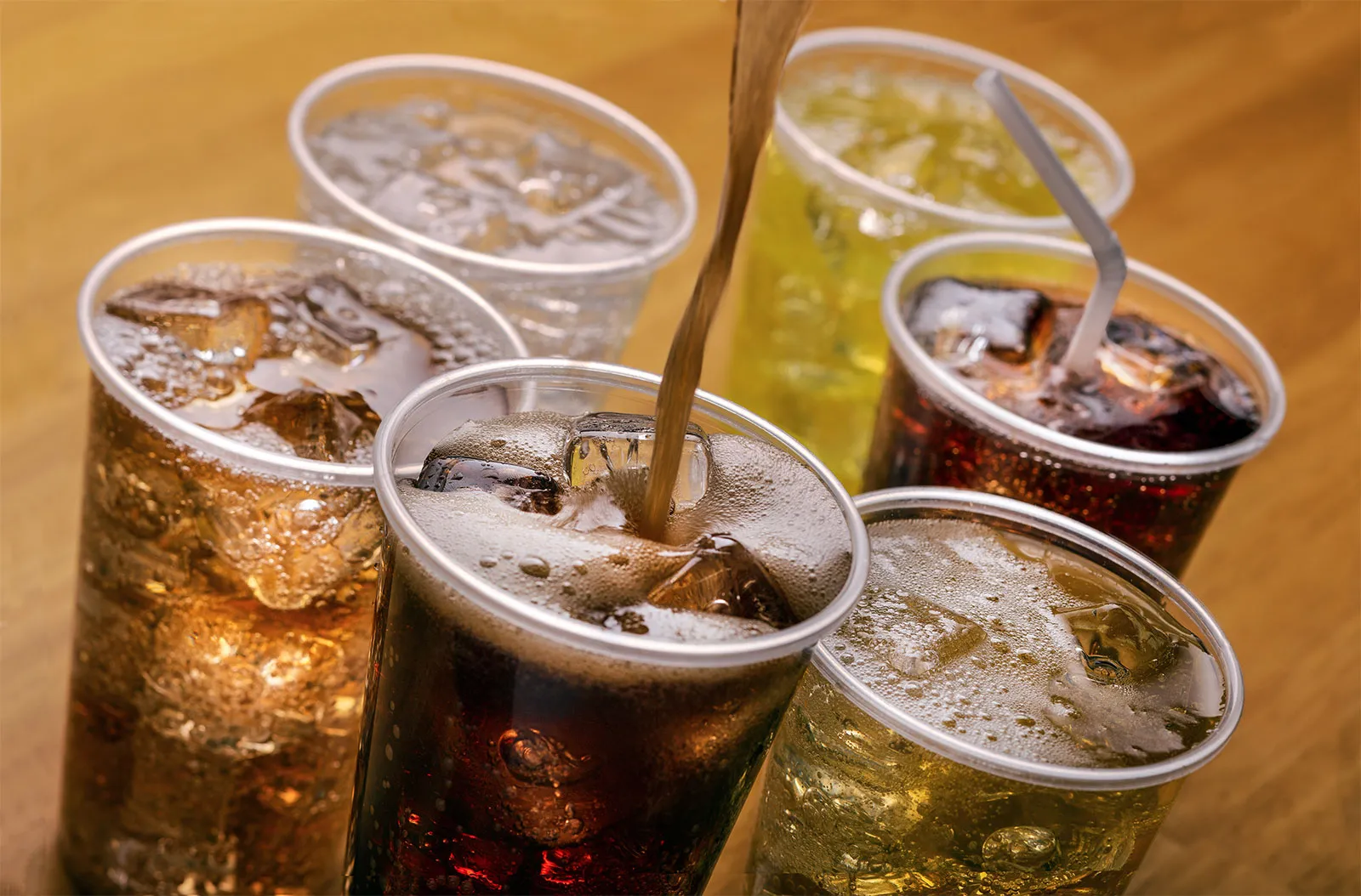 Colorful carbonated soft drinks lined up to highlight soda's spot in the 10 Most Popular Beverages in the World.