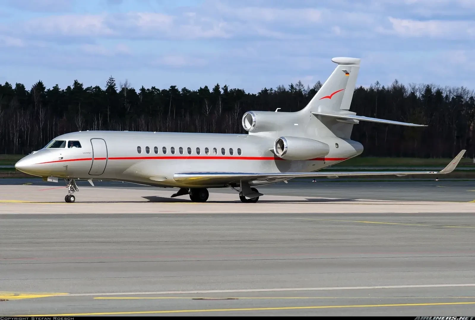 VistaJet silver-and-red jet highlighting global access in the 10 Most Popular Private Jet Charters list.