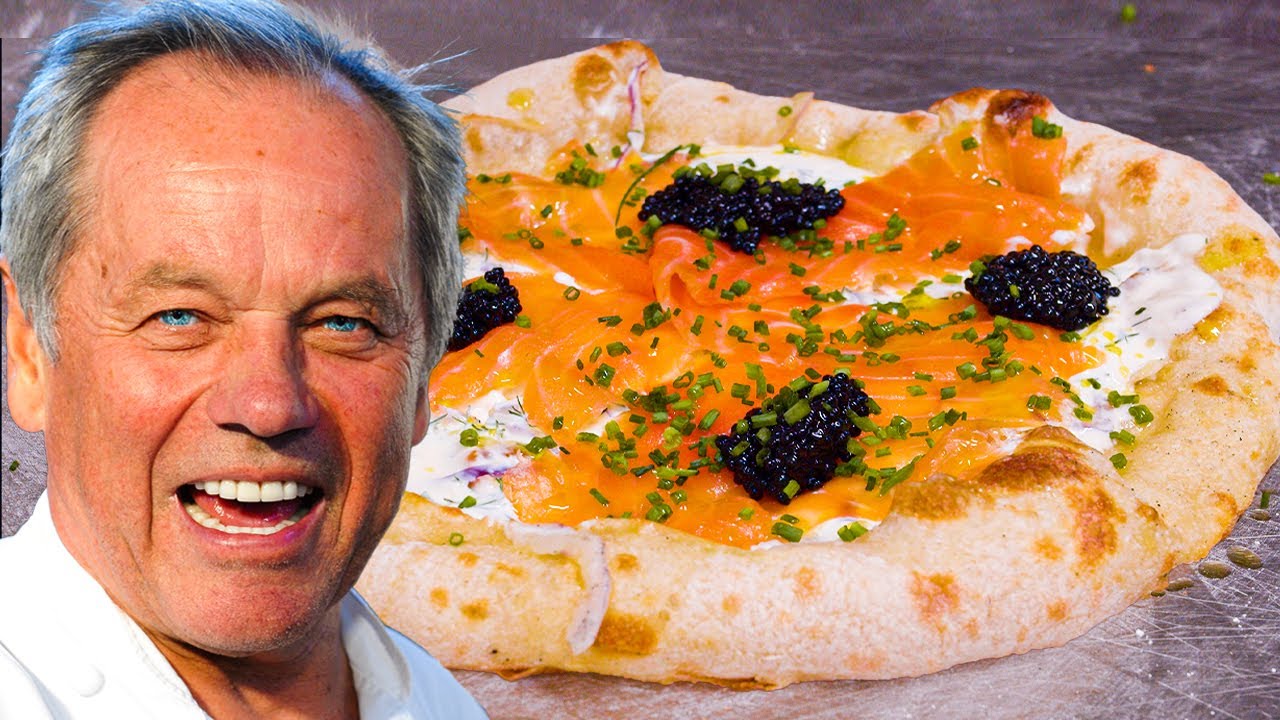 Wolfgang Puck serving smoked salmon pizza – luxury dining pioneer in the 10 Most Famous Chefs in the World and celebrity caterer.