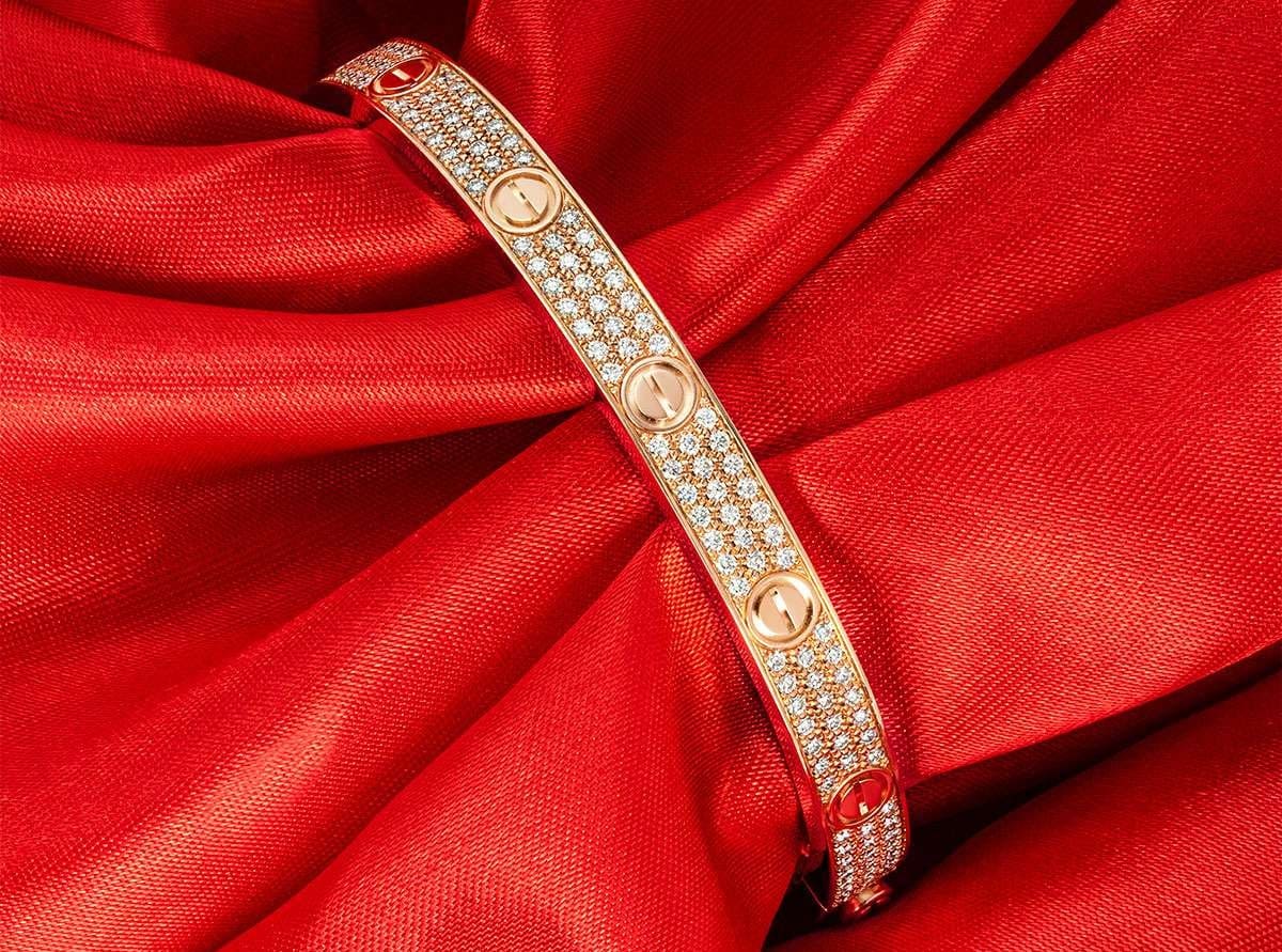 Cartier diamond Love bracelet displayed in the Ultimate Luxury Jewelry Buying Guide for iconic designer jewelry collectors.