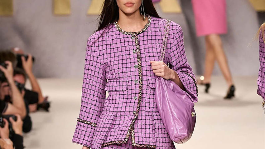 Classic Chanel tweed jacket featured in the Ultimate Luxury Fashion Buying Guide showcasing timeless French elegance.