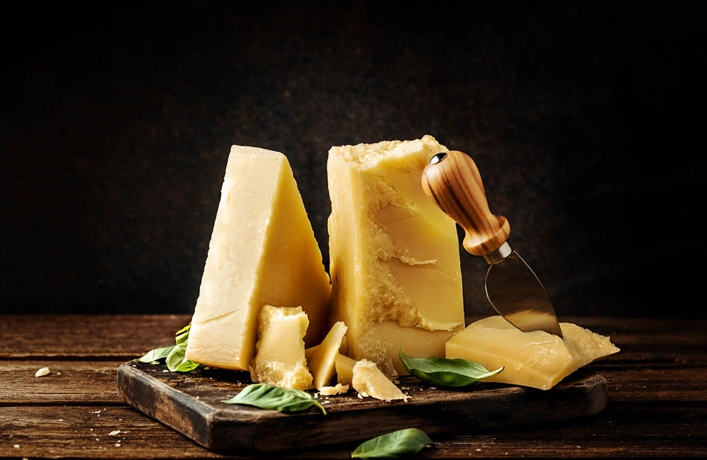 Cheese and dairy selection from the Best Gourmet Food Buying Guide, including Parmigiano, Brie, and artisan butter.