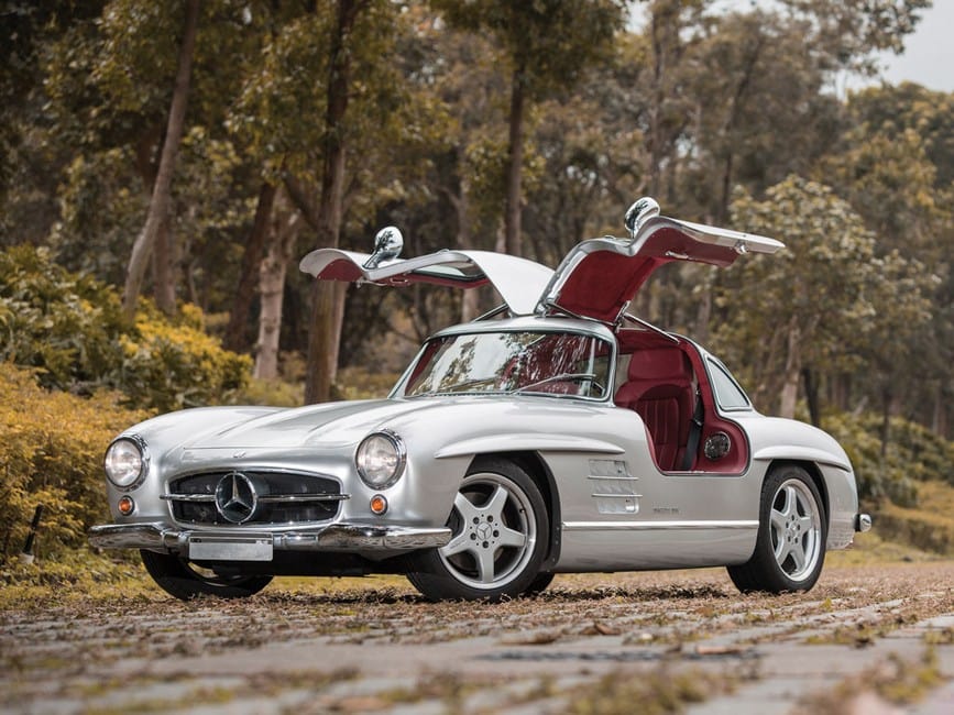 Best Luxury Assets Investment Buying Guide showcasing rare classic cars as top-performing tangible investments.