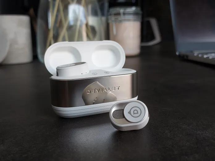 Complete Luxury Gadgets Buying Guide displaying high-end wireless earbuds with titanium design and immersive audio quality.
