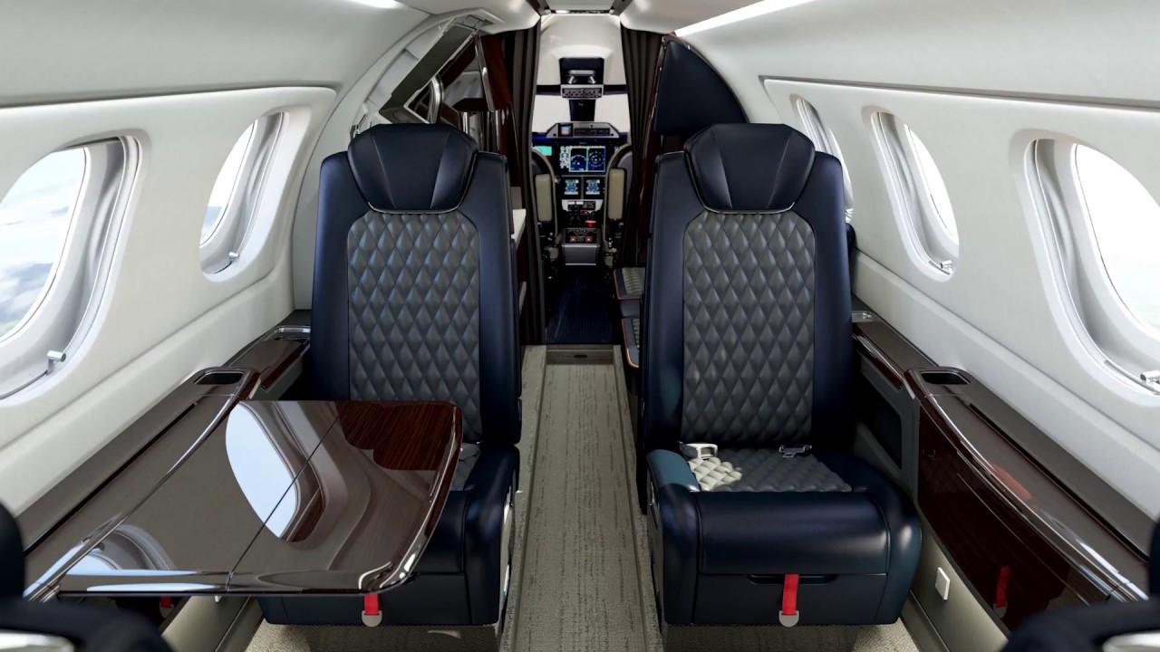 Embraer Phenom 300E jet cabin from the Complete Luxury Private Jet Buying Guide focusing on modern midsize executive travel.