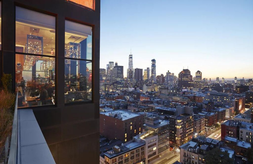 City skyline view from urban luxury hotel suite in the Ultimate Luxury Hotels Buying Guide for business-class travel insights.