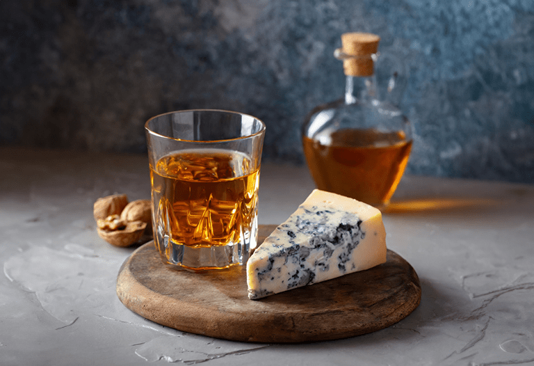 Bold whisky paired with Roquefort and grilled meats from the Luxury Fine Wines and Spirits Buying Guide for intense flavor lovers.