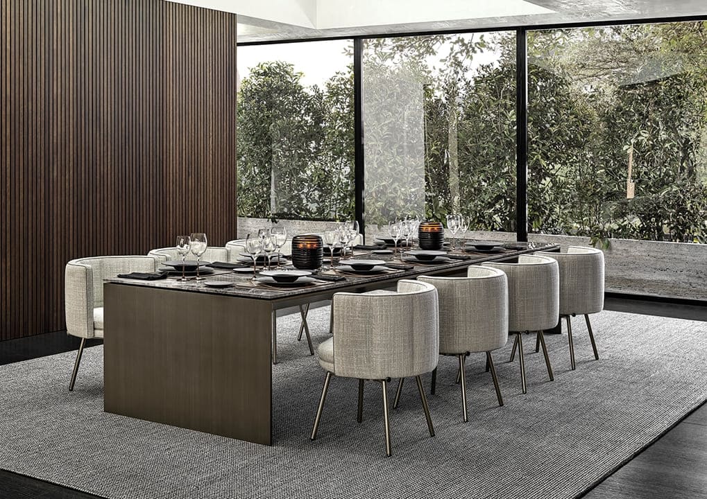 Marble dining table and suede chairs from Complete Luxury Furniture Buying Guide for upscale dining spaces.